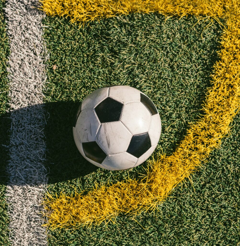 football placed in the corner of a football field